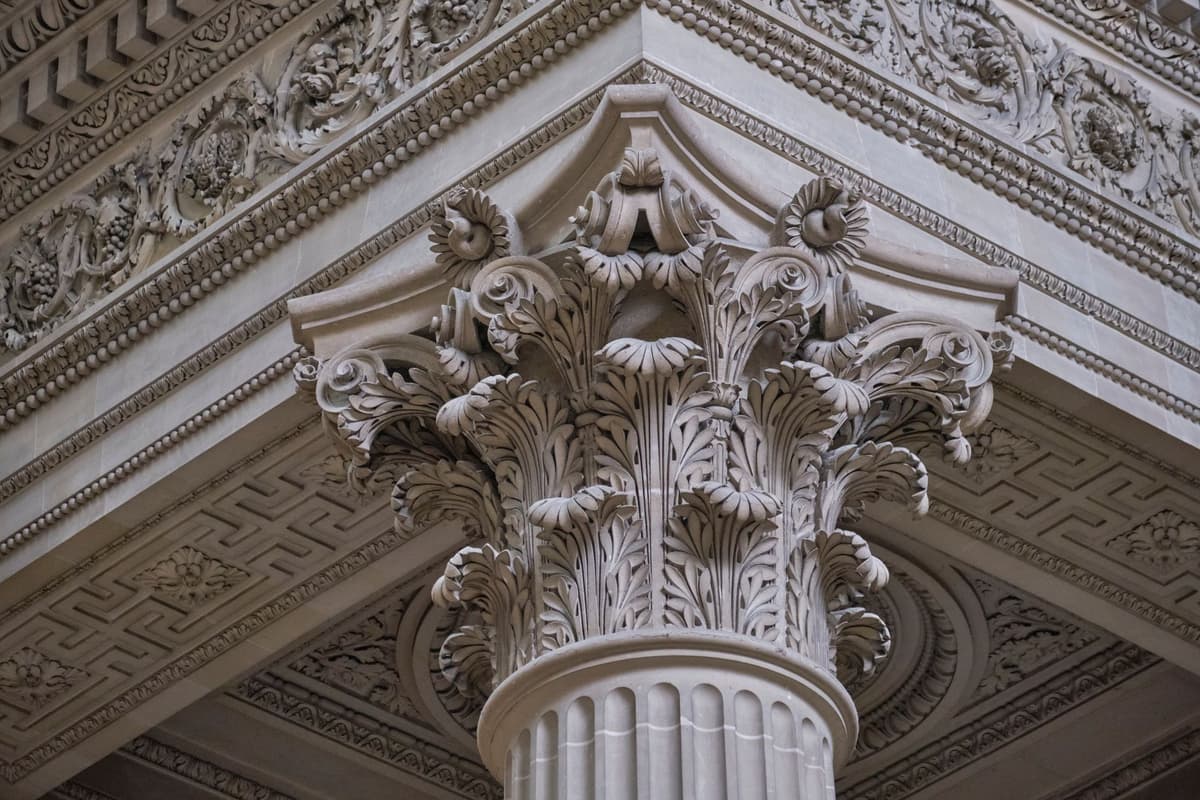 detailed close-up of a stone hyperboloid column capital