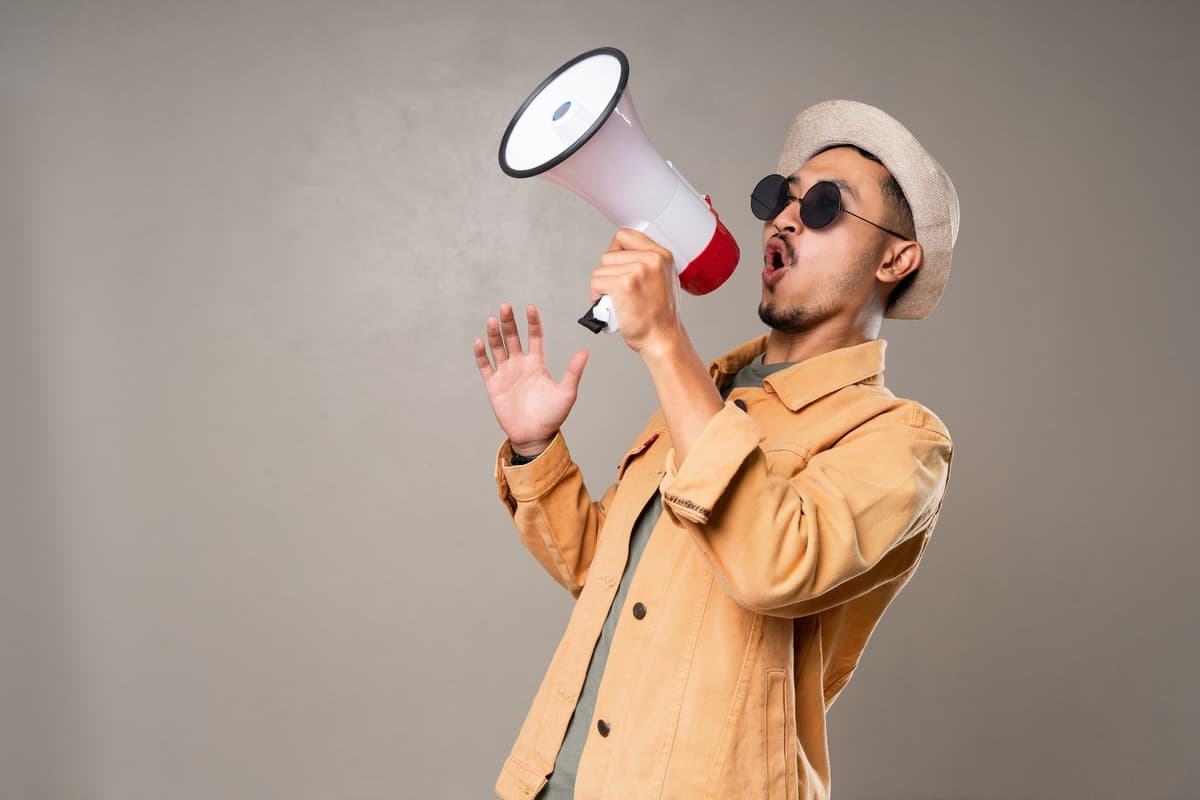 a tiny sparrow shouting into a megaphone