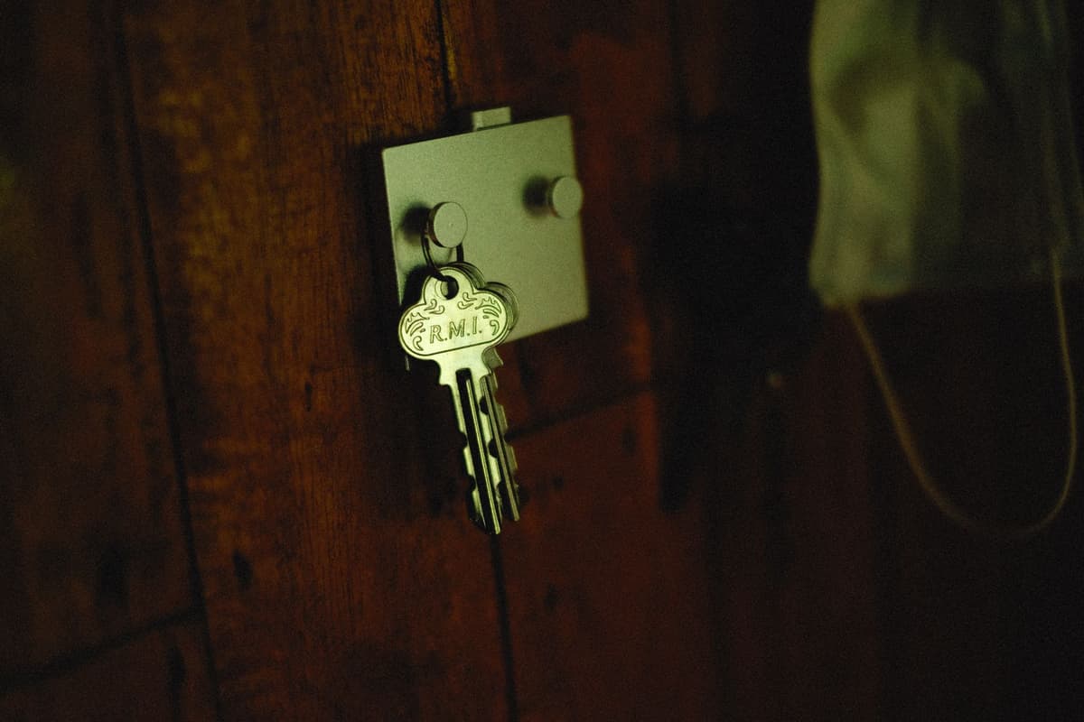 a dusty telegraph key on a wooden desk