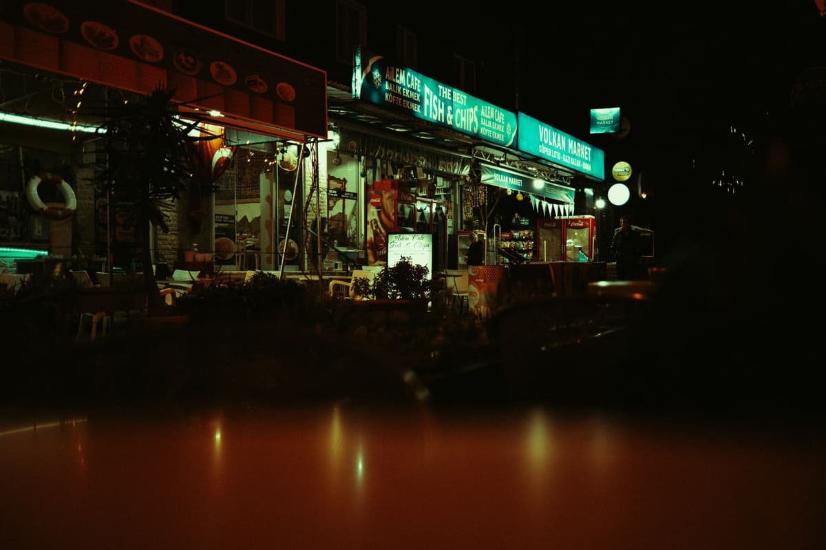 an empty neon-lit diner at 3 AM