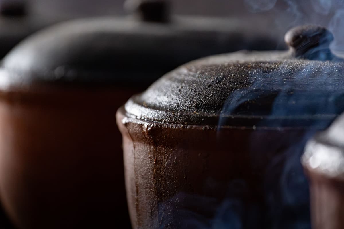 a steaming, bubbling pot of thick purple stew