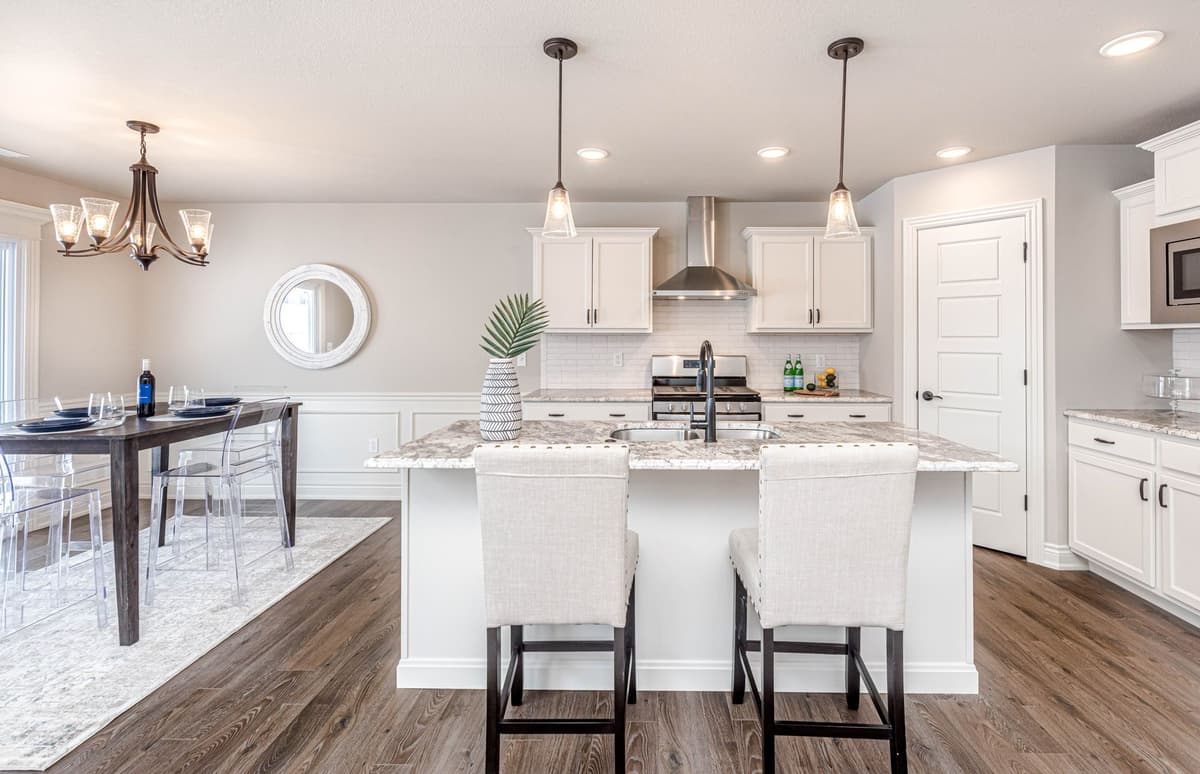 modern open concept kitchen with giant white island
