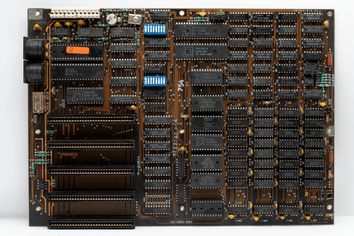a dusty green circuit board with a large black Zilog chip