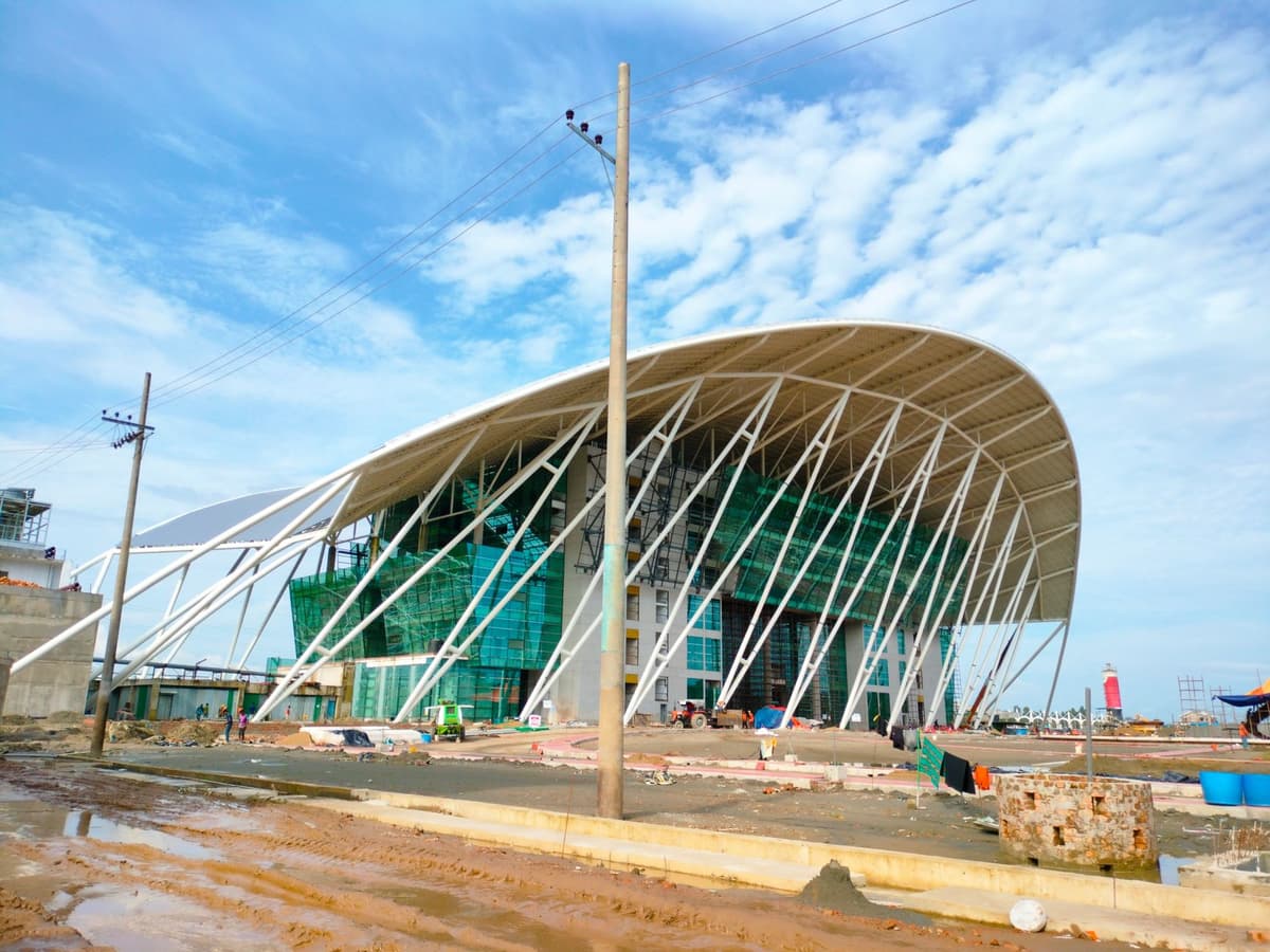 scaffolding under construction on a concrete stadium exterior