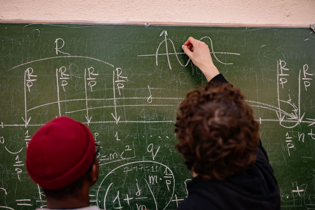 a dusty chalkboard covered in complex equations with a single bright green checkmark