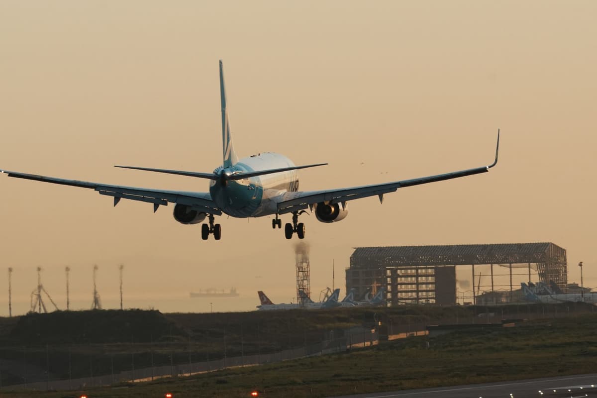 air traffic control tower overlooking a runway at dusk