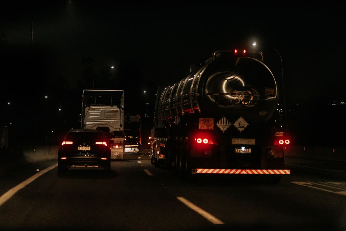 a concrete highway bridge with visible wear under heavy truck traffic