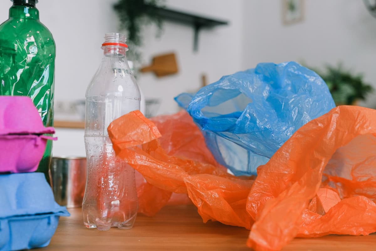 colorful plastic scraps sorted into muffin tins