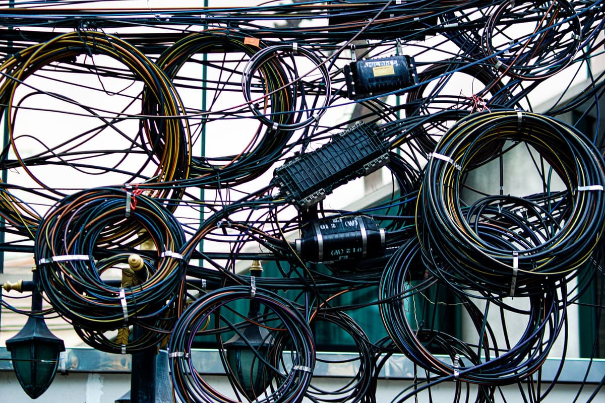a tangled mess of colorful jumper wires on a breadboard
