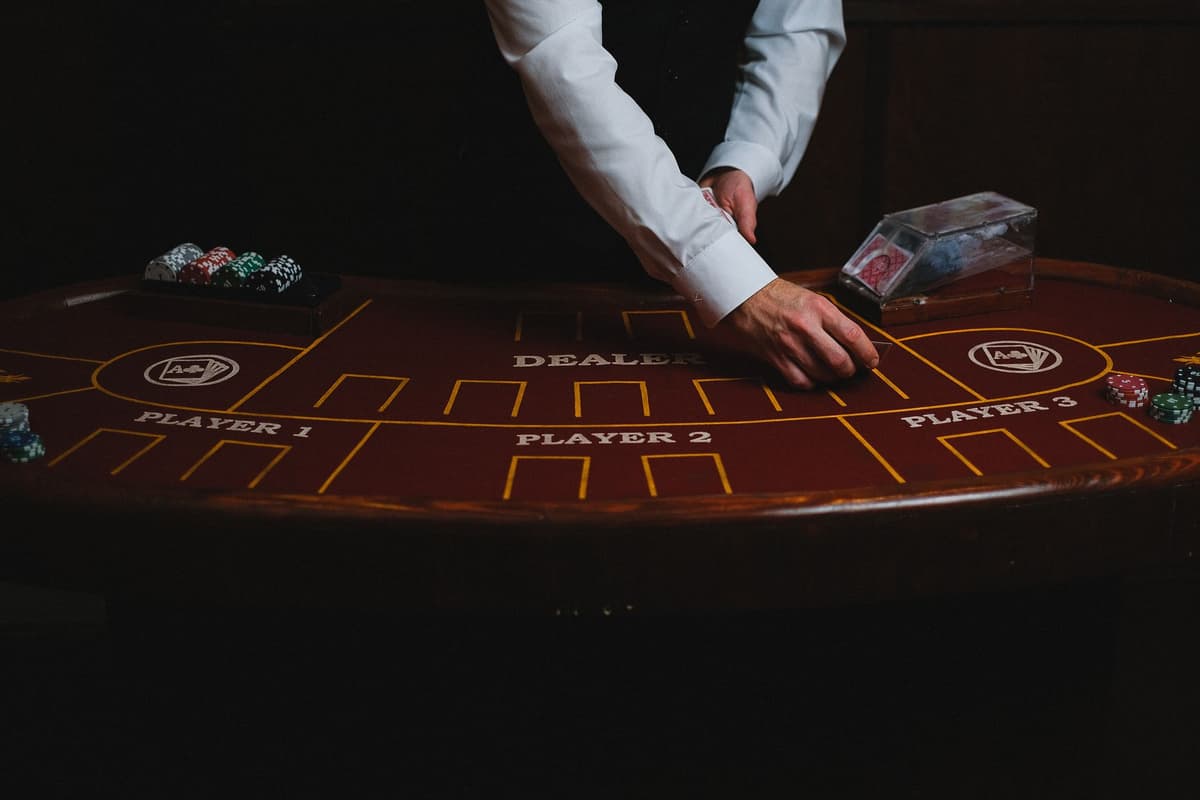 a man in a tuxedo betting a single potato at a high-stakes poker table