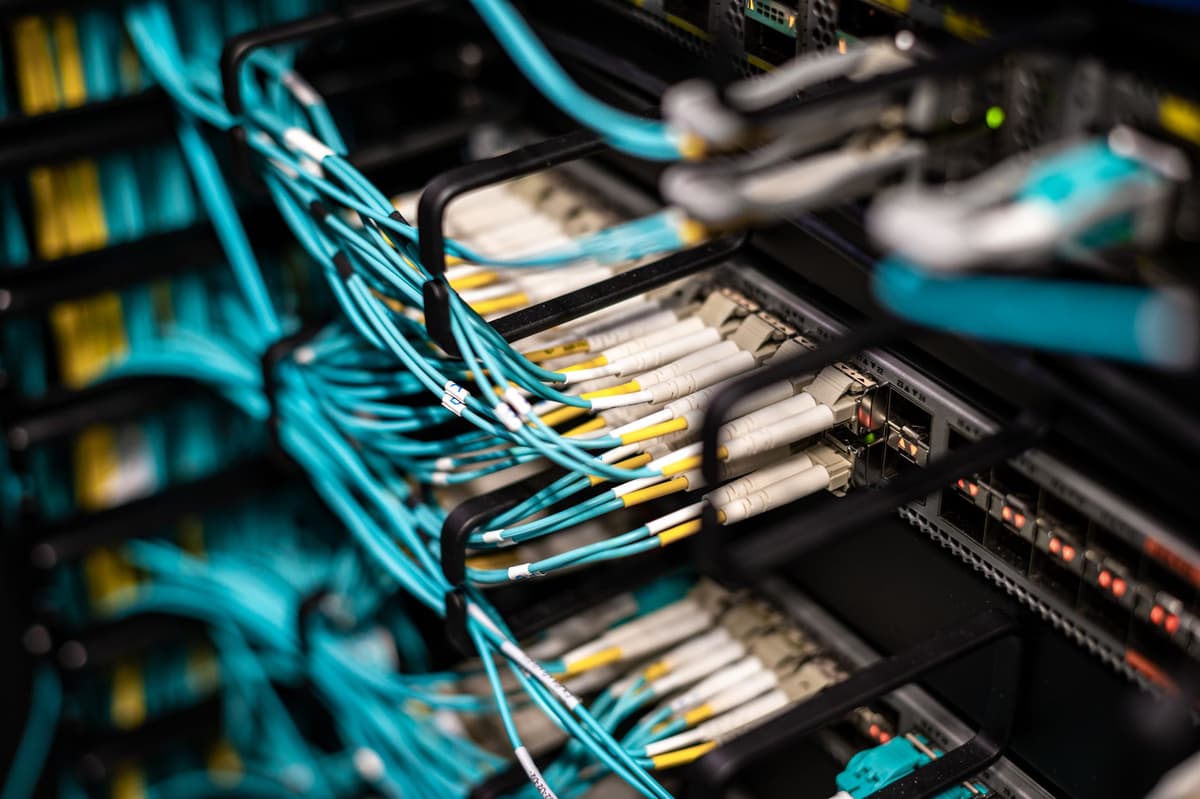 a dusty computer server with glowing blue wires