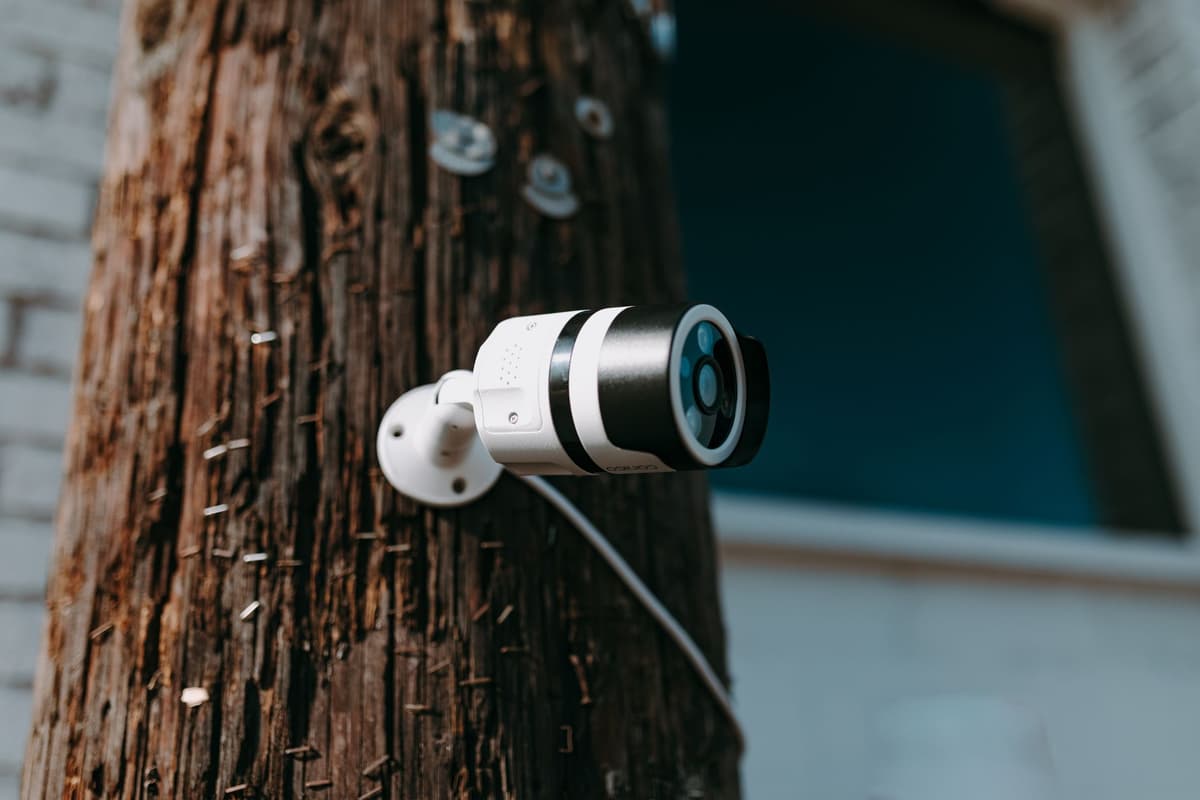 a high-resolution security camera mounted on a limestone archway