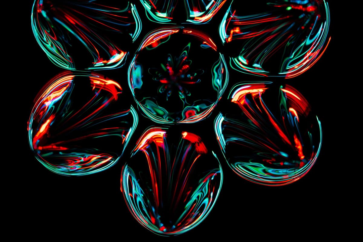 a blurry neon geometric shape on a black screen