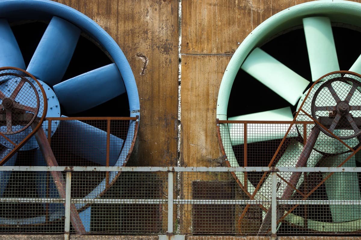 a massive industrial cooling fan covered in icicles